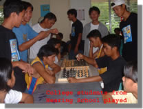 College Students from hearing-impaired play a chess 