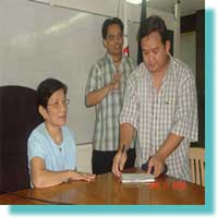 NCWDP Director Mrs. Catalina Fermin and MCCID Deaf Coordinator Sir Ervin R. Reyes sign the certificate seminars for Accessiblity