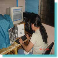 Elma J. Jalmasco typing the DEAF, Inc. History