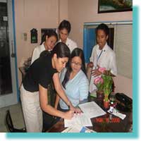 Ms. Jenny Pasion DEAF, Inc. Staff sign the Service Agreement.