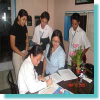 Elma J. Jalmasco MCCID student, Member sign the Service Agreement.