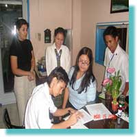 Jerome B. Tanimura MCCID student, Member sign the Service Agreement.