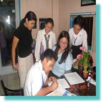 Nonito T. Visagr Jr. MCCID student, Leader sign the Service Agreement.