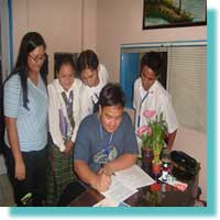 Mr. Ervin R. Reyes MCCID Coordinator sign the Service Agreement. 