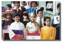 At the United Nation Day celebration elementary students have fun parading in international costumes.