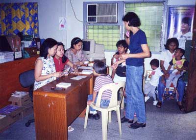 a parent being Interviewed during a client's initial evaluation.