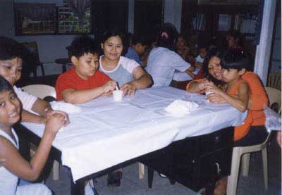 Parents assist their children during the activity.